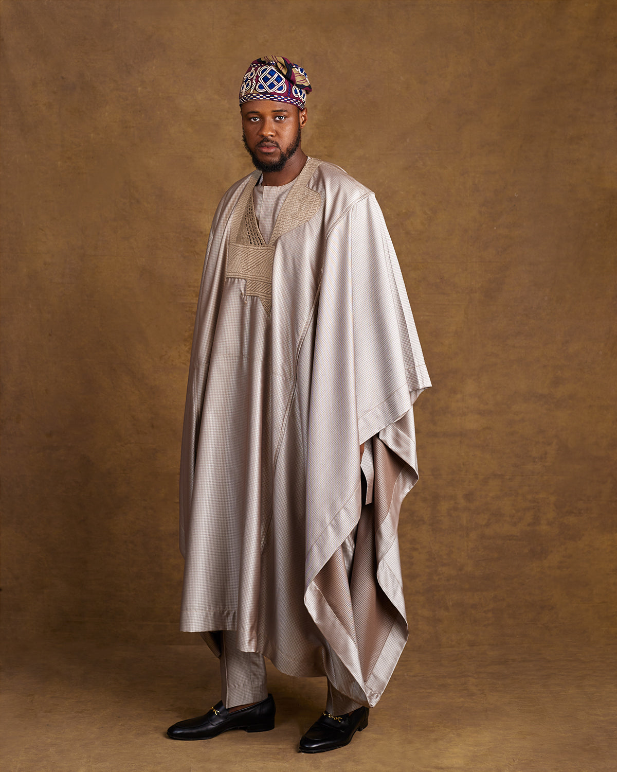Man in full robe Agbada with yoruba cap wearing it in the right direction