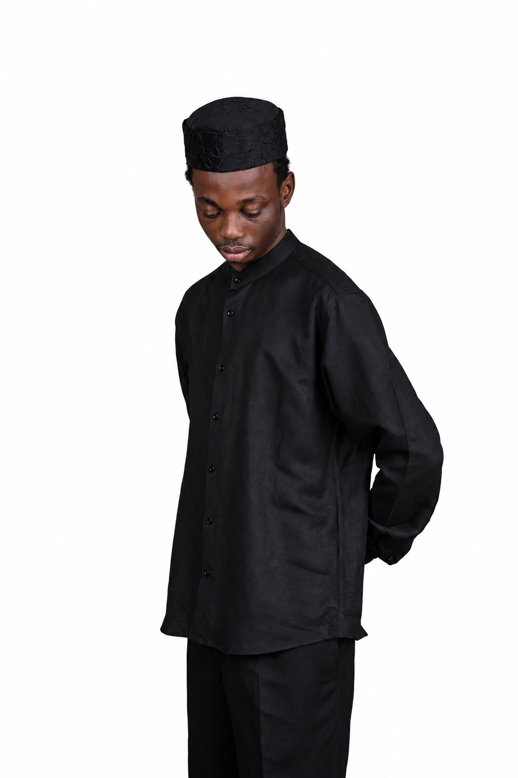Orí Adé black linen bishop-collar shirt and matching trousers — angled detail view