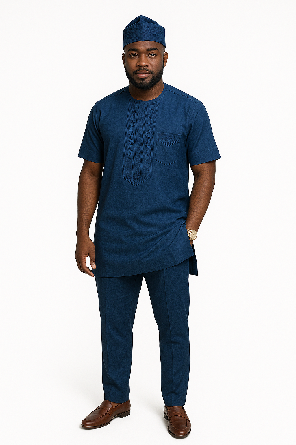 A Nigerian man wearing a deep blue embroidered native wear set, standing confidently against a white background. Perfect for weddings, events, and modern cultural style