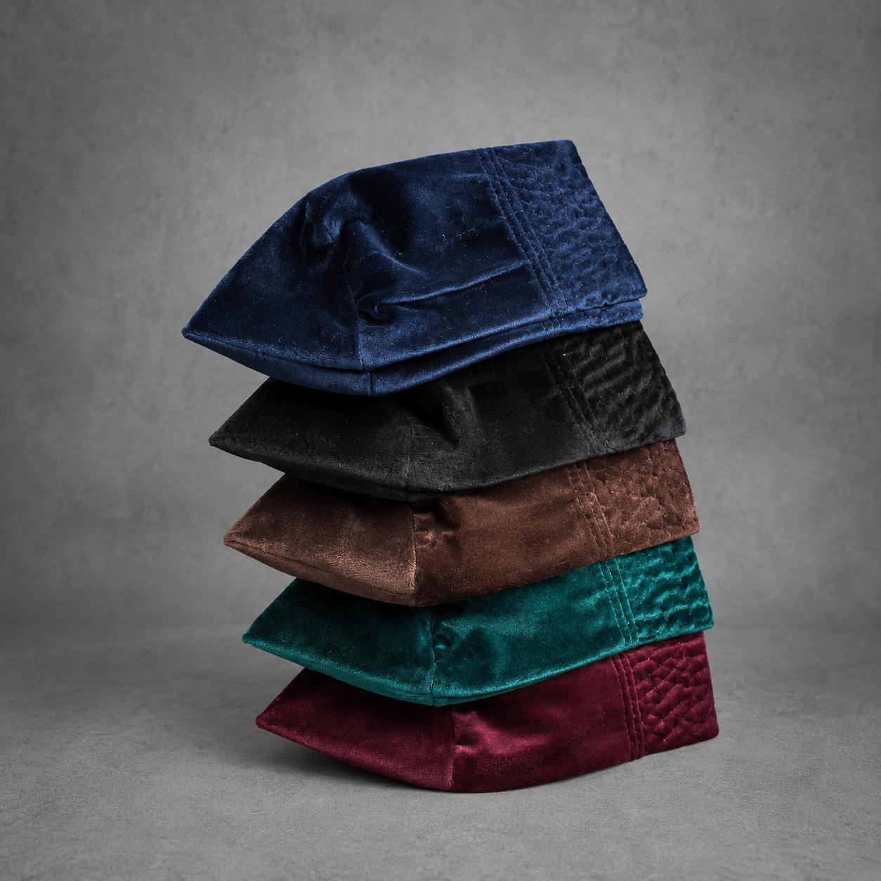 Orí Adé velvet Yoruba fila caps in navy blue, black, coffee brown, deep green and burgundy.